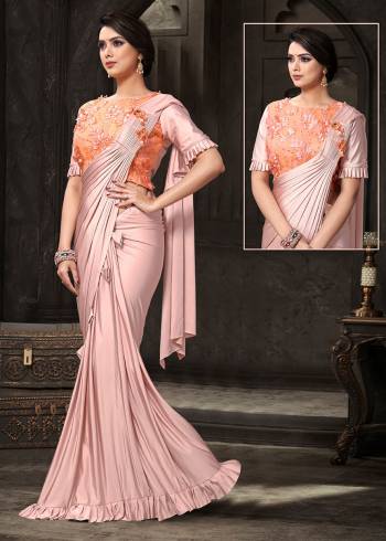 Look Pretty This Ready To Wear Design Designer Saree In Baby Pink Color Paired With Orange Colored Blouse. This Saree And Blouse Are Fabricated on Fancy Fabric. It Is Light Weight And Ensures Superb Comfort Throughout The Gala. 