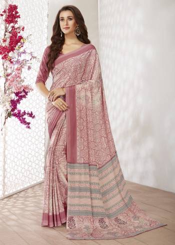 Add Some Casuals With This Pretty Saree Fabricated On Crepe. This Saree And Blouse are Beautified With prints And It Is Light Weight And Easy To Carry All Day Long