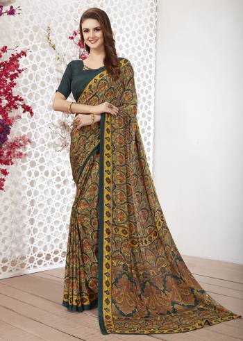 Add Some Casuals With This Pretty Saree Fabricated On Crepe. This Saree And Blouse are Beautified With prints And It Is Light Weight And Easy To Carry All Day Long