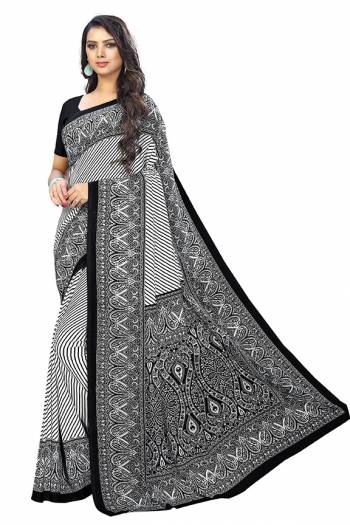 Add Some Casuals With This Pretty Saree Fabricated On Crepe. This Saree And Blouse are Beautified With prints And It Is Light Weight And Easy To Carry All Day Long