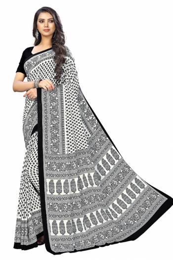 Add Some Casuals With This Pretty Saree Fabricated On Crepe. This Saree And Blouse are Beautified With prints And It Is Light Weight And Easy To Carry All Day Long