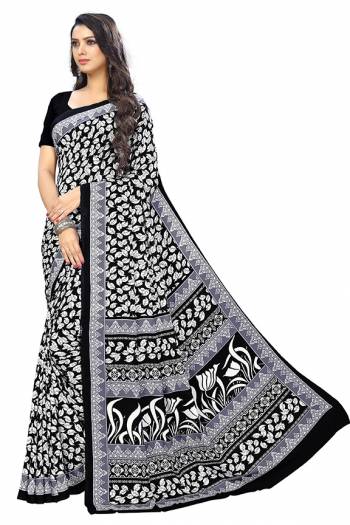 Add Some Casuals With This Pretty Saree Fabricated On Crepe. This Saree And Blouse are Beautified With prints And It Is Light Weight And Easy To Carry All Day Long