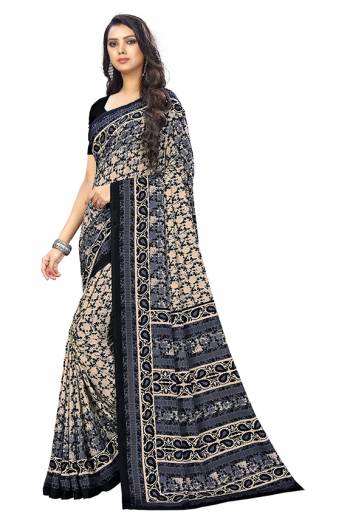 Add Some Casuals With This Pretty Saree Fabricated On Crepe. This Saree And Blouse are Beautified With prints And It Is Light Weight And Easy To Carry All Day Long