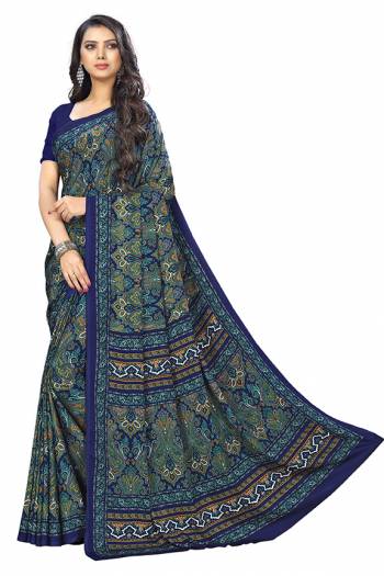 Add Some Casuals With This Pretty Saree Fabricated On Crepe. This Saree And Blouse are Beautified With prints And It Is Light Weight And Easy To Carry All Day Long