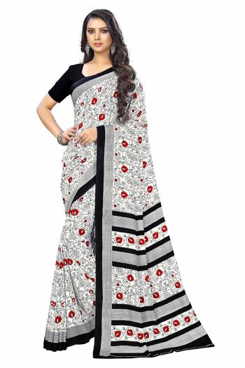 Add Some Casuals With This Pretty Saree Fabricated On Crepe. This Saree And Blouse are Beautified With prints And It Is Light Weight And Easy To Carry All Day Long