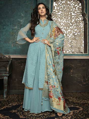 Celebrate This Festive Season Weaing This Very Pretty Designer Suit In Sky Blue Color. Its Pretty Top Is Silk Based Paired With Net Fabricated bottom And Jacquard Dupatta With Attractive Print And Weave. 