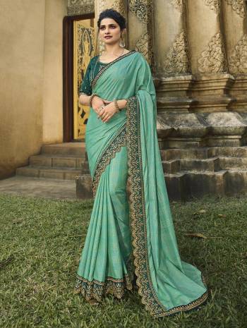 Go With Lovely Shades Of Fresh Green Color With This Designer Saree In Sea Green Color Paired With Teal Green Colored Blouse. This Saree Is Fabricated On Soft Silk Paired With Art Silk Fabricated Blouse. It IS Beautified With Attractive Embroidered Lace Border And Heavy Embroidered Blouse. 