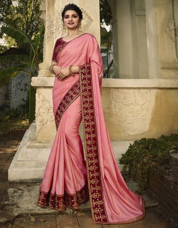 Look Pretty This Pink Colored Designer Saree Paired With Contrasting Maroon Colored Blouse. This Saree Is Fabricated On Soft Silk Paired With Art Silk Fabricated Blouse. Its Lovely Color Pallete Will Earn You Lots Of Compliments From Onlookers. 