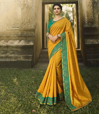 Add This Beautiful Designer Saree To Your Wardrobe In Musturd Yellow Color Paired With Contrasting Sea Green Colored Blouse. This Saree Is Fabricated On Chinon Chiffon Paired With Art Silk Fabricated Blouse. Buy This Lovely Colored Saree Now. 