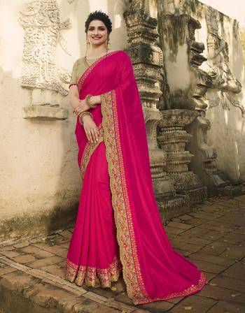 Catch All The Limelight At The Next Wedding You Attend Wearing This Attractive Looking Designer Saree In Rani Pink Color Paired With Contrasting Beige Colored Blouse. This Pretty Saree Is Fabricated On Raw Silk Paired With Art Silk Fabricated Blouse. 