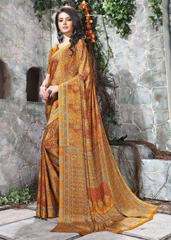 Add Some Casuals With This Pretty Saree Fabricated On Crepe. This Saree And Blouse are Beautified With prints And It Is Light Weight And Easy To Carry All Day Long