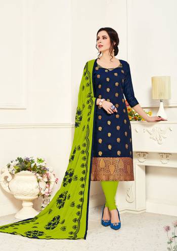 Celebrate This Festive Season In This Beautiful Designer Dress Material In Navy Blue Colored Top Paired with Contrasting Parrot Green Colored Bottom And Dupatta. Its Top Is Banarasi Silk Based Paired With Cotton Bottom And Chiffon Fabricated Embroidered Dupatta. 