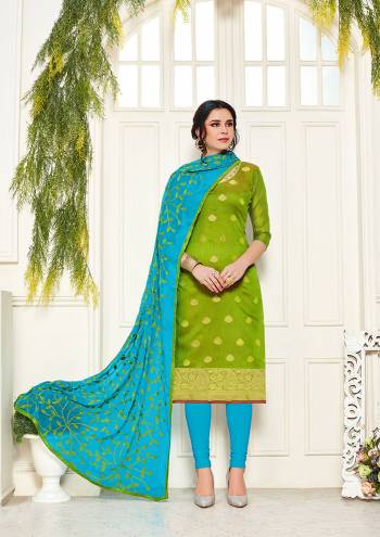 Look Pretty Wearing This Designer Dress Material In Parrot Green Colored Top Paired With Sky Blue Colored Bottom And Dupatta. Its Top Is Fabricated On Banarasi Silk Paired With Cotton Bottom And Chiffon Fabricated Embroidered Dupatta. 