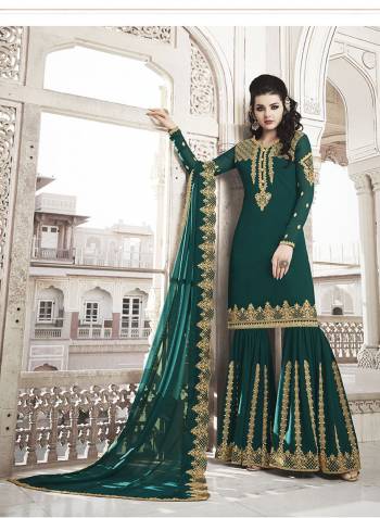 Celebrate This Festive And Wedding Season Wearing This Heavy Designer Suit In Teal Green Color. Its Embroidered Top And Dupatta are Fabricated On Georgette Paired With Soft Silk Fabricated Embroidred Bottom. 