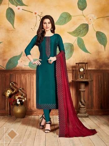 Celebrate This Festive Season With Beauty And Comfort By Getting This Dress Material Stitched As Per Your Desired Fit And Comfort. Its Top And bottom Are In Teal Blue Color Paired With Contrasting Red Colored Dupatta. Its Top Is Fabricated On Pandora Silk Paired With Santoon Bottom And Cotton Silk Dupatta. 