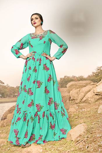 Celebrate This Festive Season With And Comfort Wearing This Designer Readymade Gown In Sea Green Color, This Gown Is Georgette Based Beautified With Floral Prints All Over. 