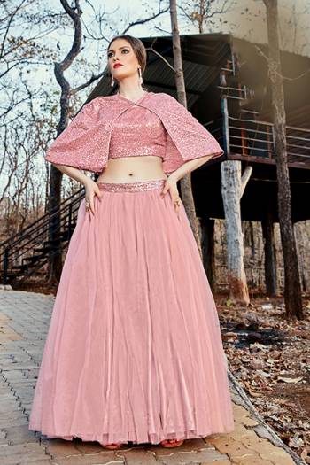 Catch All The Limelight At The Next Function You Attend Wearing This Designer Readymade Pair Of Crop Top And Skirt In Baby Pink Color. This Top Is Imported Fabric Based Paired With Net Fabricated Skirt. 