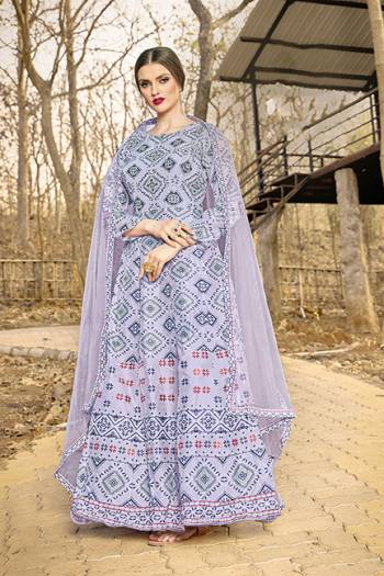 Celebrate This Festive Season With And Comfort Wearing This Designer Readymade Gown In Grey Color, This Gown Is Art Silk Based Paired With Net Fabricated Dupatta. 