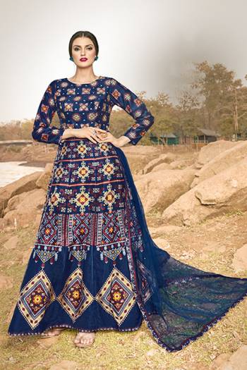 Celebrate This Festive Season With And Comfort Wearing This Designer Readymade Gown In Navy Blue Color, This Gown Is Art Silk Based Paired With Net Fabricated Dupatta. 