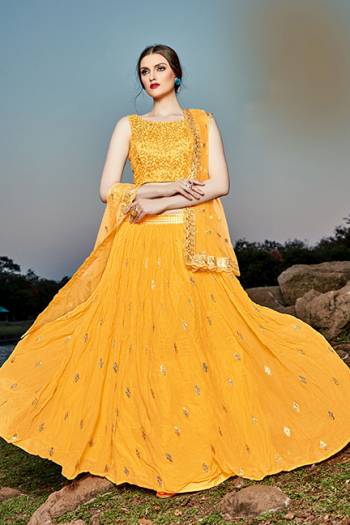 Grab This Pretty Designer Lehenga Choli In Yellow Color. Its Blouse And Lehenga Are Fabricated on Georgette Paired With Net Fabricated Dupatta. 