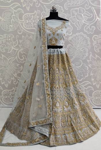 This Wedding Season Be The Most Trendiest Diva Wearing This Heavy Designer Lehenga Choli In Baby Blue Color. Its Pretty And Detailed Heavy Embroidered Blouse, Lehenga And Dupatta Are Fabricated On Net. Its Pretty Color And Detailed Embroidery Will Earn You Lots Of Compliments From Onlookers. 