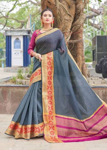 Enhance Your Personality Wearing This Designer Sare In Grey Color Paired With Contrasting Magenta Pink Colored Blouse. This Saree And Blouse Are Fabricated On Handloom Silk Beautified With Weave And Embroidery Over Blouse. Buy This Saree Now.