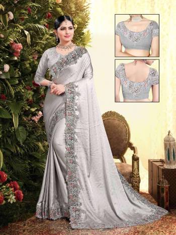 Flaunt Your Rich and Elegant Taste Wearing This Designer Saree In Light Grey Color. This Saree Is Fabricated On Satin Georgette Paired With Art Silk Fabricated Blouse. It Is Beautified With Elegant Heavy Embroidered Lace Border. Buy Now.