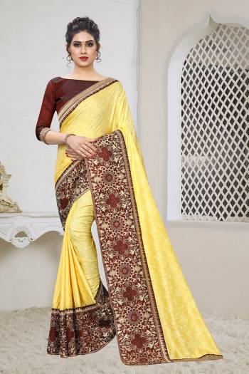 Celebrate This Festive Season With This Designer Elegant Saree In Yellow Color Paired With Contrasting Maroon Colored Blouse. This Saree Is Fabricated On Jacquard Silk Paired With Art Silk Fabricated Blouse. Its Broad Border Is Beautified With Heavy Jari & Stone Work. 