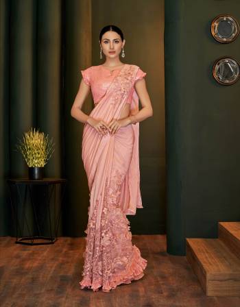 A classy , sophisticated and graceful pick, this saree is a modern take on evergreen outfits. Pair with subtle jewels to complete the look. 