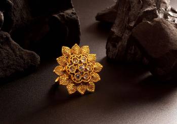 Here Is Royal Looking Designer Finger Ring In Golden Color Beautified With Stone Work. The Rich Golden Color And Pattern Will Give An Elegant Look To Your Hand, Buy Now.