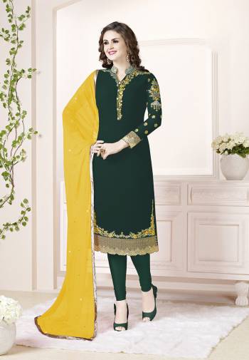 Add This Beautiful Designer Straight Suit To Your Wardrobe In Dark Green Color Paired With Yellow Colored Dupatta. Its Top Is Fabricated On Georgette Paired With Santoon Bottom And Chiffon Dupatta. Its Fabric Is Light In Weight And Easy To Carry All Day Long