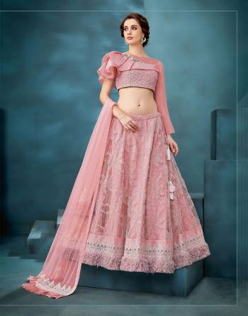 Make headlines in this exclusive combination of Pastels, furs and embellishments in the best possible way in this eye-catching lady-like lehenga . Pair with delicate jewels to complete the look. 
