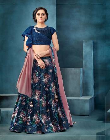 Make a strong case for mystical florals with  glittering sequins in this fancy velvet lehenga paired with asymettrical glittering blouse. Pair with minimal accessories to complete the look. 