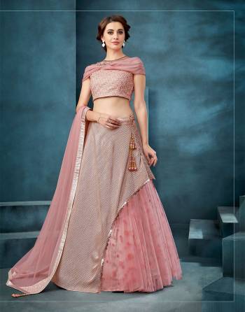 Have a little fun with the conventional silhouette accentuated with crushed-texture in this pretty pink lehenga. Opt for a low side-bun and go with or without dupatta and strut in style. 