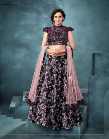 Adorn this upscale and uber stylish lehenga that is a sparkling mix of floral prints, sequins and frills to take on any soiree. 