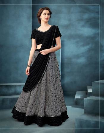 This subtle grey and black lehenga is  Classic and stylish in equal measure for your best evening outlook. Adorn it with statement oxidized jewels to look picture perfect. 