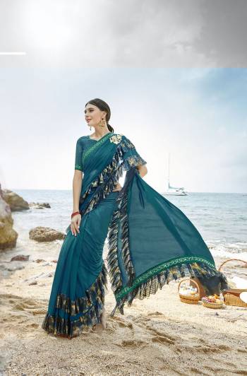 Add This Trendy Designer Ruffle Saree To Your Wardrobe In Blue Color. This Pretty Saree Is Fabricated On Lycra Paired With Art Silk Fabricated Blouse. It Is Beautified With Pretty Ruffles And Hand Embroidered Patch Work. 