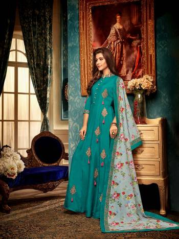 You Will Definitely Earn Lots Of Compliments Wearing This Designer Readymade Gown In Teal Blue Color Paired With A Very Pretty Digital Printed Dupatta In Pastel Blue Color. This Lovely Pair Is Fabricated On Muslin Beautified With Detailed Embroidery. Buy Now.