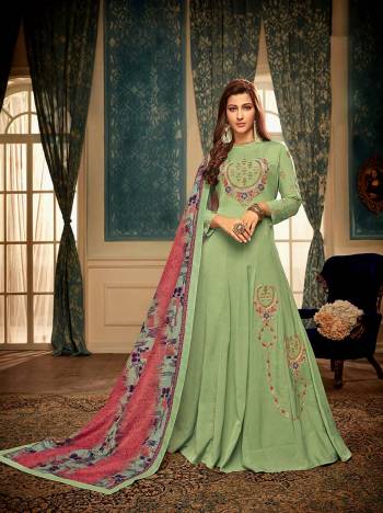 Celebrate This Festive Season Wearing This Readymade Gown In Light Green Color Paired With Contrasting Pink And Multi Color Dupatta. This Pretty Embroidered Gown And Digital Printed Dupatta Are Muslin Based Which IS Soft Towards Skin And Easy To Carry All Day Long. 