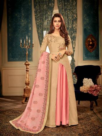 You Will Definitely Earn Lots Of Compliments Wearing This Designer Readymade Gown In Beige Color Paired With A Very Pretty Digital Printed Dupatta In Pink Color. This Lovely Pair Is Fabricated On Muslin Beautified With Detailed Embroidery. Buy Now.