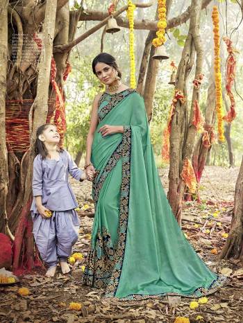 Celebrate This Festive Season Wearing This Pretty Saree In Sea Green Color Paired With Sea Green Colored Blouse. This Saree And Blouse Are Silk Based Which Also Gives A Rich Look To Your Personality. Buy Now.