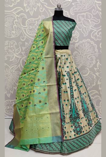 Here Is Rich Silk Based Designer Lehenga Choli In Green And Cream Color. Its Pretty Blouse And Lehenga Are Silk Based Paired With Banarasi Silk Weaved Dupatta. Buy This Semi-Stitched Lehenga Choli Now.