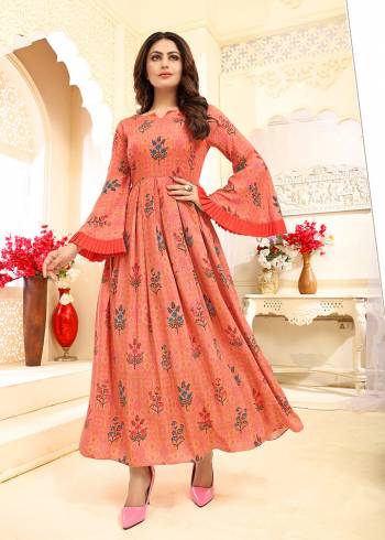 Celebrate This Festive Season With Beauty And Comfort Wearing This?Designer Readymade Gown In Orange Color Fabricated On Rayon. It Is Beautified With Prints. Buy Now