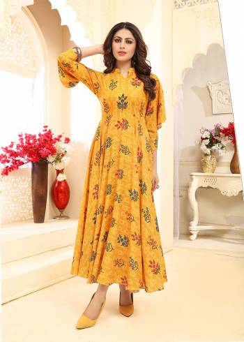 Add This Beautiful Readymade Gown To Your Wardrobe In Yellow Color. This Pretty Gown Is Fabricated On Rayon Beautified With Prints All Over. This Gown Is Soft Towards Skin Which Is Light Weight And Easy To Carry All Day Long.