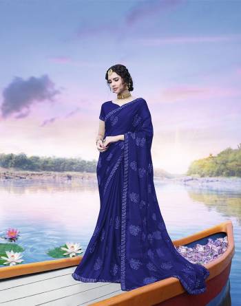 You Will Definitely Earn Lots of Compliments Wearing This Designer Tone To Tone Embroidered Saree In Royal Blue Color. This Pretty Saree Is Fabricated On Chinon Paired With Art Silk Fabricated Blouse. Buy Now.