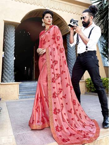 Adorn The Pretty Angelic Look Wearing This Lovely Pink Colored Saree Paired With Red Colored Blouse. This SareeIs Fabricated On Silk Gergette Paired With Art Silk Fabricated Blouse. Its Lovely Color And Rich Fabric Will Earn Yu Lots Of Compliments From Onlookers.