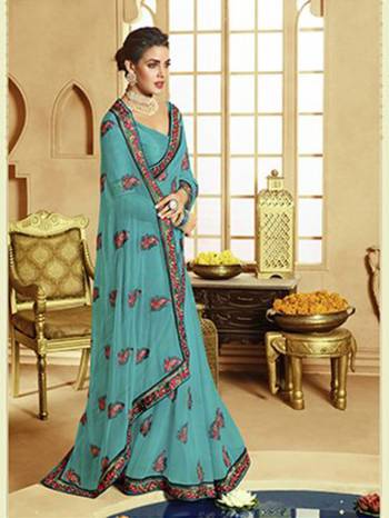 Catch All The Limelight At The Next Function You Attend Wearing This Pretty Designer Saree In Blue Color. This Lovely Saree Is Fabricated On Georgette Paired With Art Silk Fabricated Blouse. It Is Beautified With Multi Colored Thread Work Givng An Attractive Look. Buy Now.