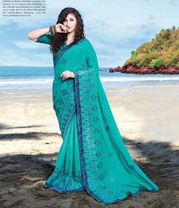 Enhance Your Personality Wearing This Designer Saree In Turquoise Blue Color. This Pretty Tone To Tone Embroidered Saree Is Fabricated On Satin Georgette Paired With Art Silk Fabricated Blouse. Also It Is Light Weight And easy To Drape.?