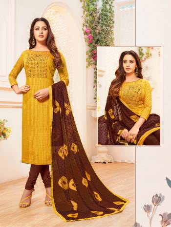 Add This Designer Straight Suit To Your Wardrobe In Musturd Yellow Colored Top Paired With Contrasting Brown Colored Bottom And Dupatta. Its Top and Bottom are Cotton Based Paired With Chiffon Fabricated Dupatta. 