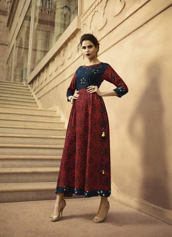 For Your Semi-Casual Wear, Grab This Designer Readymade Kurti In Maroon And Navy Blue Color Fabricated On Rayon Beautified With Prints. 